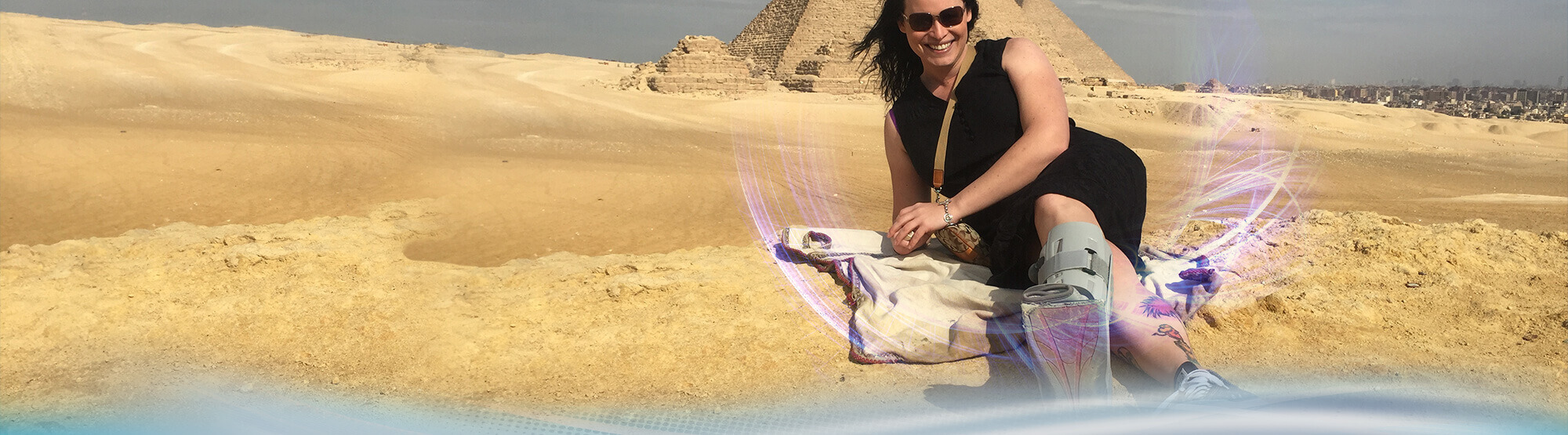 Woman next to pyramid